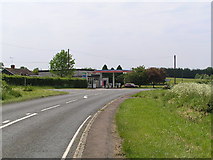 SO9755 : Tolleys Garage and the lane towards Flyford Flavell by Richard  Dunn