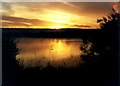 Sunrise over a lake near Leybourne