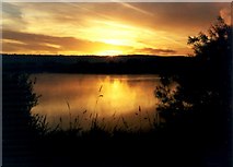 TQ7059 : Sunrise over a lake near Leybourne by Hywel Williams