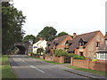 Houses and railway bridge, on B4009 at Longwick