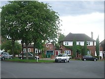 TQ1665 : Houses in Southwood Gardens at the southern junction with Claygate Lane by Andrew Longton