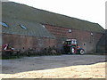 Massive barn and old machinery.