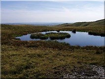 SN7987 : Boggy pond on Plynlimon's eastern col by Rudi Winter