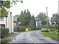 Wood End Lane, many a slipped wheel between road and garden.