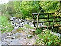NY2822 : Footbridge Over Brockle Beck at Springs Wood by Mick Garratt
