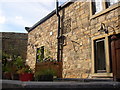 Carved stone on cottage, High Hoyland