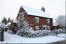 SK8770 : Blacksmiths Cottage in the snow by Richard Croft