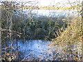 SU0394 : River Thames in foreground perched above flooded gravel pit by Peter Watkins