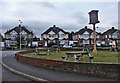 Garden of New River Arms, with pub sign and houses in High Road, Turnford, in background