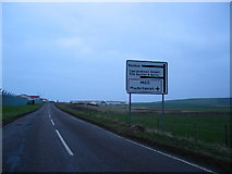 NR6623 : Direction signs to Machrihanish Airfield and Vestas by Johnny Durnan