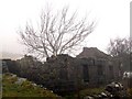 Derelict cottage in low cloud