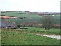 SW9546 : Vose Farm with daffodil fields by David Smith