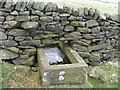 Stone trough in wall.