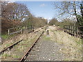 Redundant railway crosses Sweeney Lane