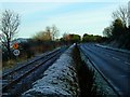 NH5946 : Rail and road together by Toby Speight