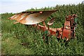 Plough on the edge of the field.