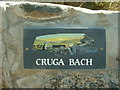 Gate sign for Cruga Bach