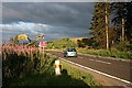 At the junction of the Rosarie Farm lane and the A95.