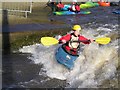 A kayaker playing at the Tees Barrage