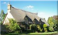 Cotswold stone, thatched house