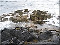 NG1346 : Rocks at Low Tide - Neist Point by John Allan