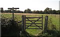 Gate and fingerpost on Moatfield Lane