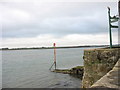 Danger marker on jetty at Porth yr Aur