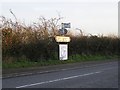 Signpost to Leavenheath Village Hall