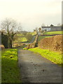 Ffordd y Fron stretching uphill towards the Owain Glyndwr public house