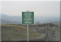 The former hippy site and a new control sign at the gate to the First-Hydro road