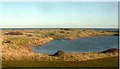 NU0347 : Pond near Far Skerr by Stanley Howe