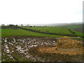 SW9042 : Hay feeder in front of view across dip by Kieran Evans