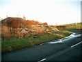 Road junction with waste wood pile