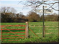 Farmland and finger post on junction of Sheerwater road.