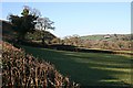 Fields sloping down to the river