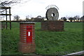 TM1894 : Village Sign & Post Box at Tharston by Phil Whiscombe