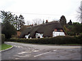 Road junction by Crawley pond