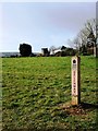 Footpath marker, Windmill in the background