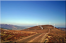 NH5671 : Windfarm looking towards the Sutors by Mark McLaren