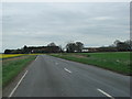 SE6909 : Sandtoft Road,  with Stoupersgate Farm on the right. by Bill Henderson