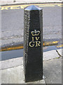 King George IV Bollard on the Pavement of Doric Way, London NW1