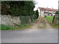 NZ4439 : Cottages at entrance road to Hardwick Hall Manor and  Farm by Carol Rose