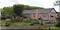 SX3891 : Pink house near Vennmoor Plantation by Jon Coupland