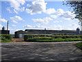 Farm buildings by road junction at Summerstown, Marsh Gibbon