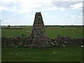 Cairn built into stone dyke