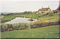 Chedington: pond and cottage