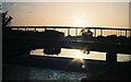 SZ1196 : Throop: footbridge at sunset by Chris Downer