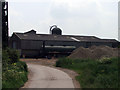 SK7763 : Farm buildings and tanker at Hill Farm by James Hill