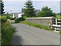 Railway bridge with cottages beyond