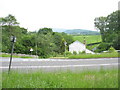 Old Station House at Drws y Nant seen across a new section of the A494